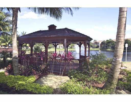 3870 Lyons Road, Unit 1018 Coconut Creek, FL 33073 - Photo 4 of 5 a view of street with sitting area