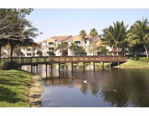 3870 Lyons Road, Unit 1018 Coconut Creek, FL 33073 - Photo 5 of 5 a swimming pool view with a lake view