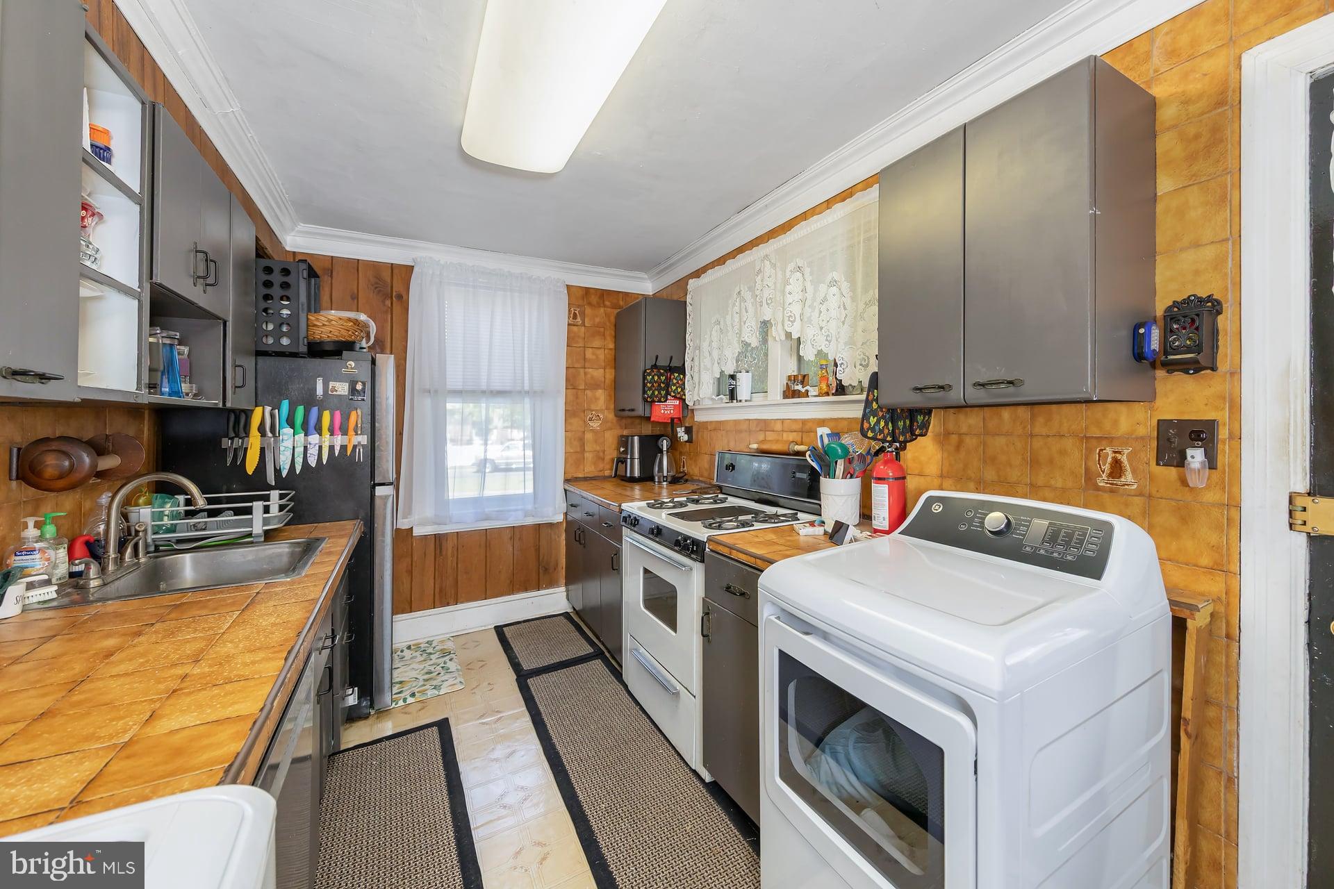 401 West Avenue Delanco, NJ 08075 - Photo 6 of 19 a kitchen that has a stove and a microwave