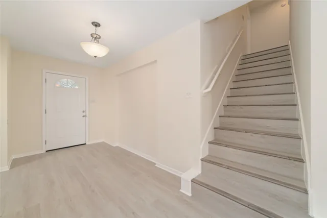 a view of an entryway with stairs