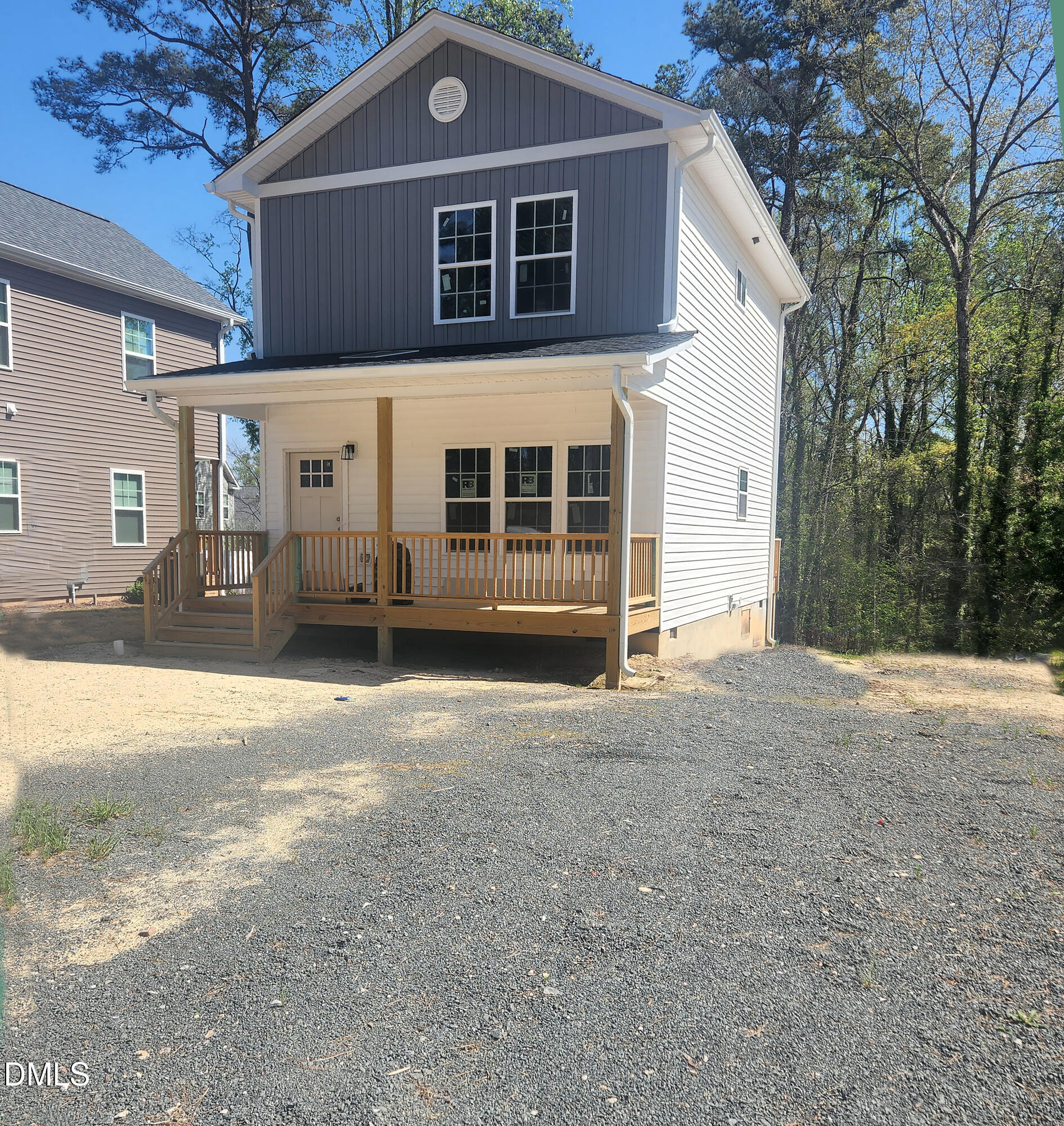 1009 Ridge Rock Road Raleigh, NC 27610 - Photo 1 of 8 a front view of a house with a yard