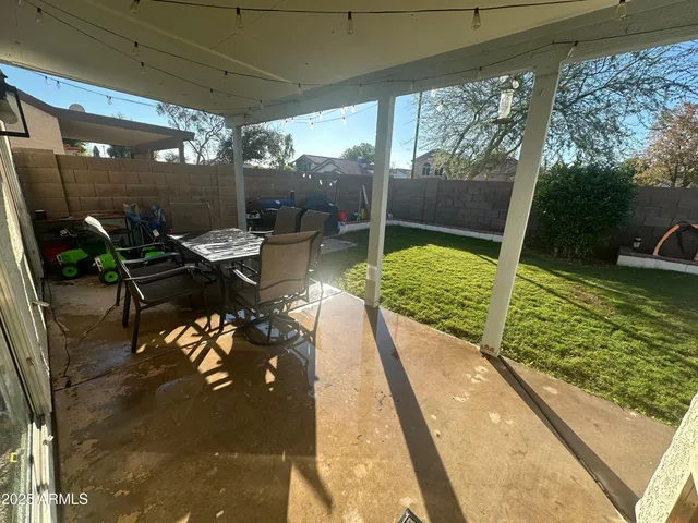 a view of swimming pool with a patio