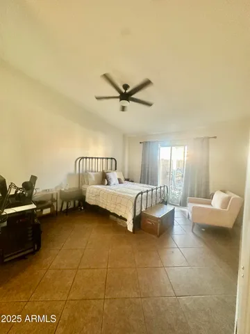 a bed room with a bed and a couch