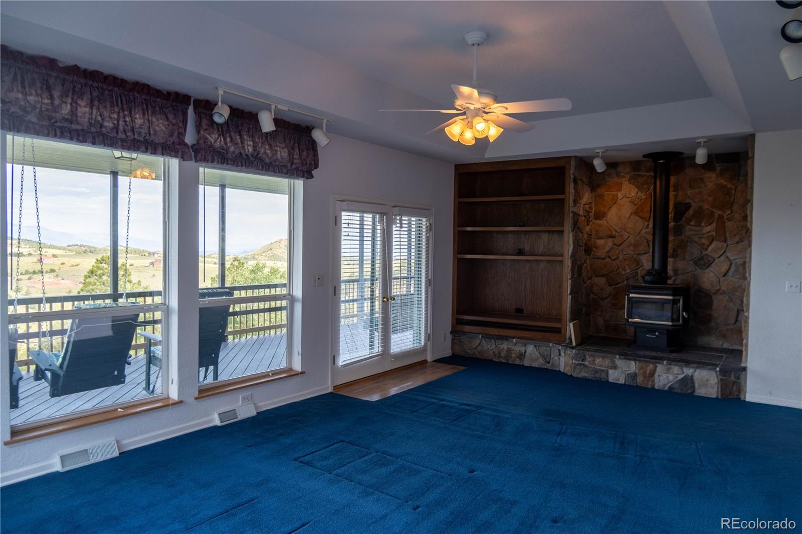 950 Junkins Loop Westcliffe, CO 81252 - Photo 11 of 35 wooden floor in an empty room with a window