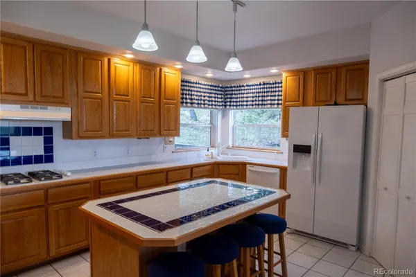 a kitchen with cabinets and window