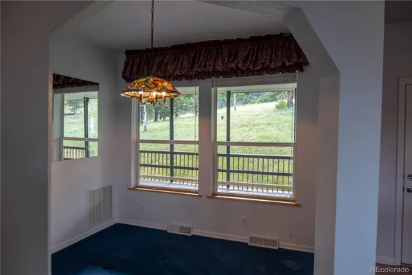a room that has a bed and a window