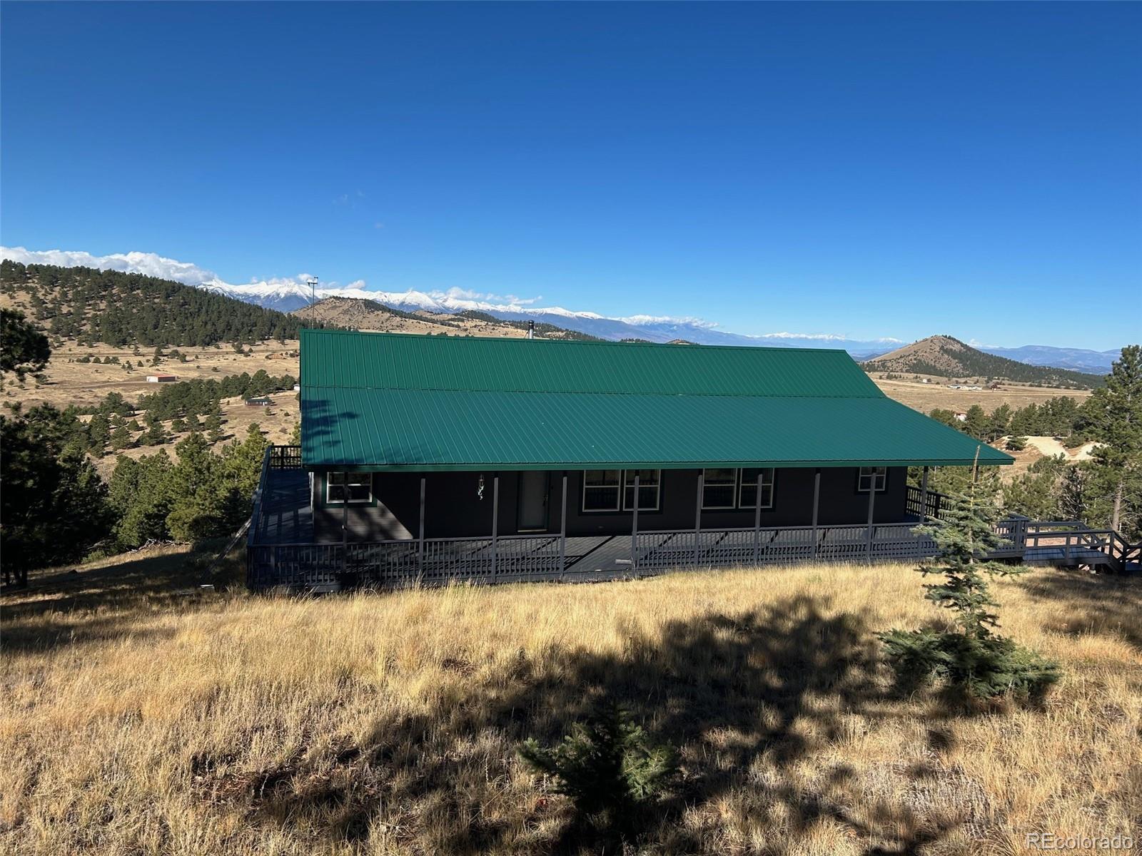 950 Junkins Loop Westcliffe, CO 81252 - Photo 2 of 35 a view of house with a yard