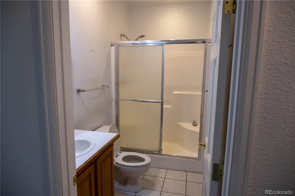 a bathroom with a shower and a toilet