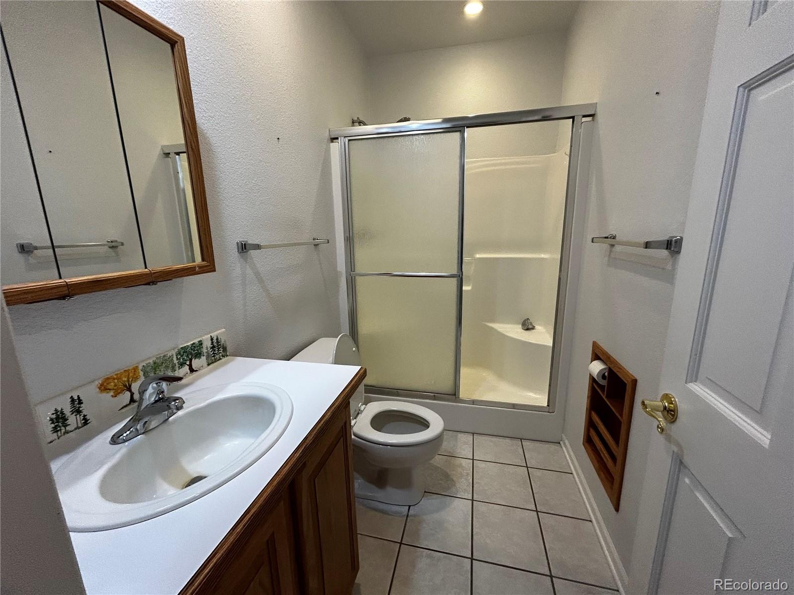 950 Junkins Loop Westcliffe, CO 81252 - Photo 30 of 35 a bathroom with a sink toilet and shower