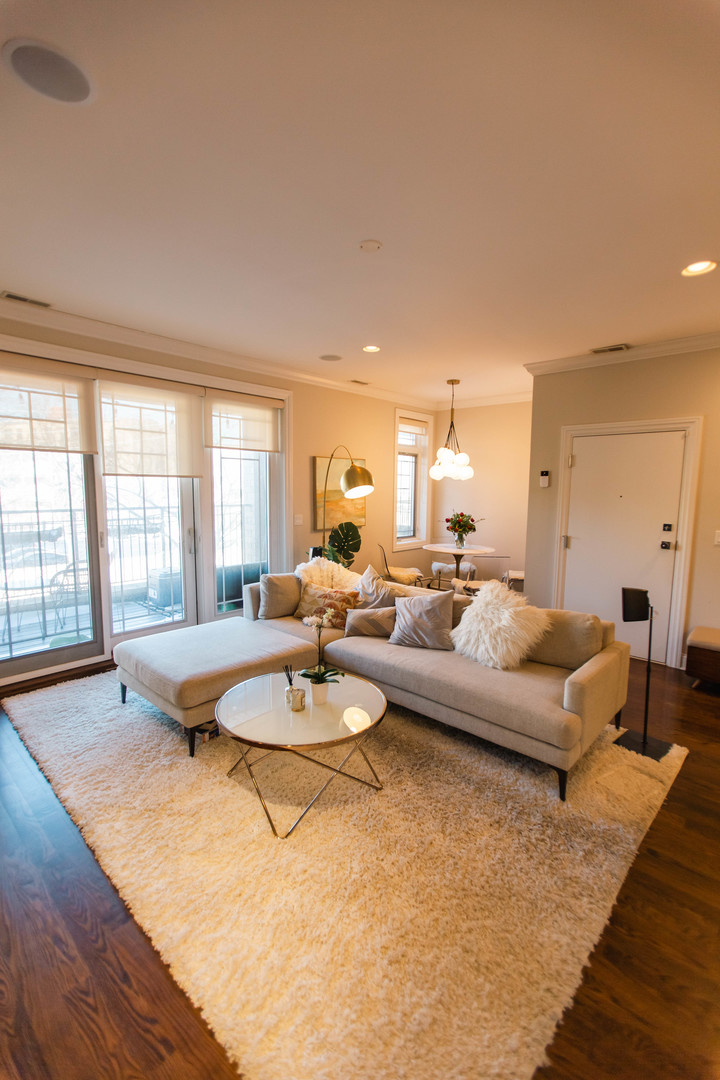 843 West Fletcher Street, Unit 2W Chicago, IL 60657 - Photo 2 of 35 a living room with furniture and a large window
