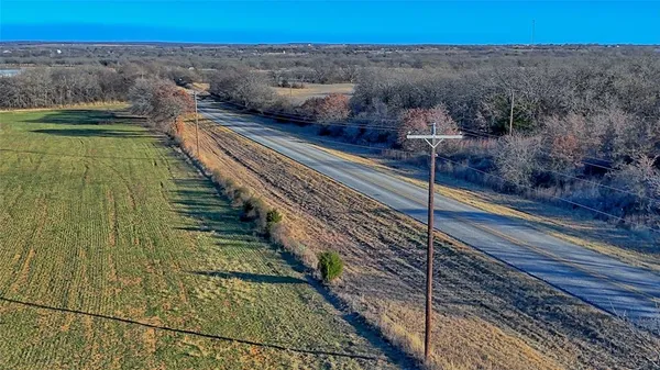 a view of a field with an ocean