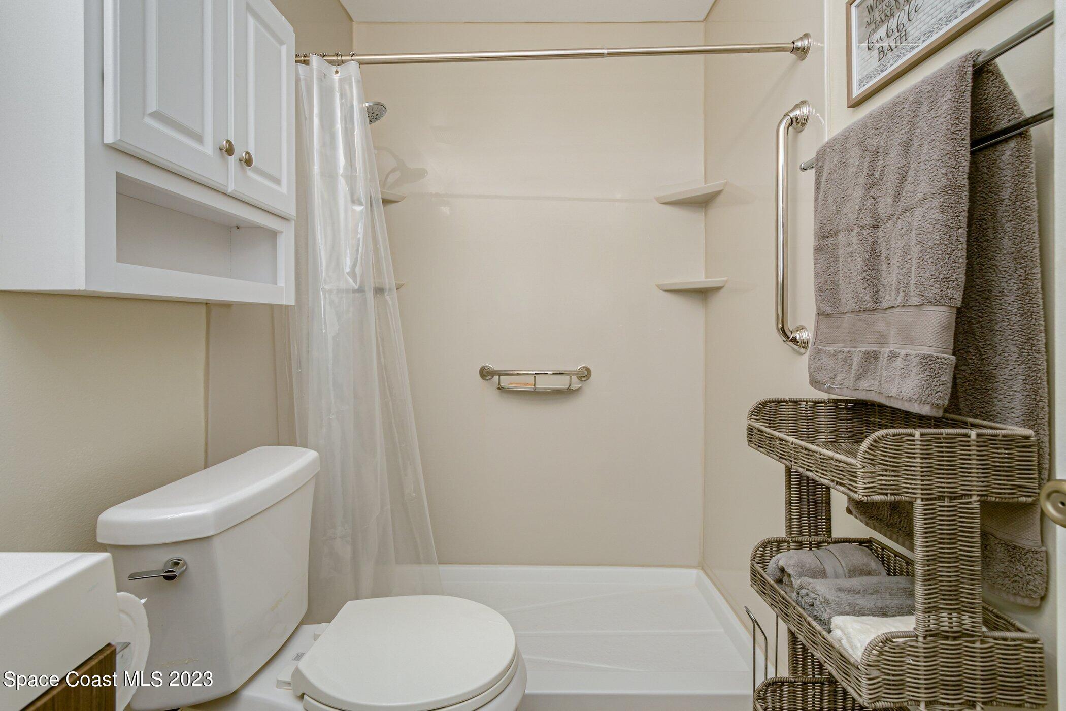 905 Prosperity Place, Unit 1902 Rockledge, FL 32955 - Photo 21 of 35 a bathroom with a toilet and a shower