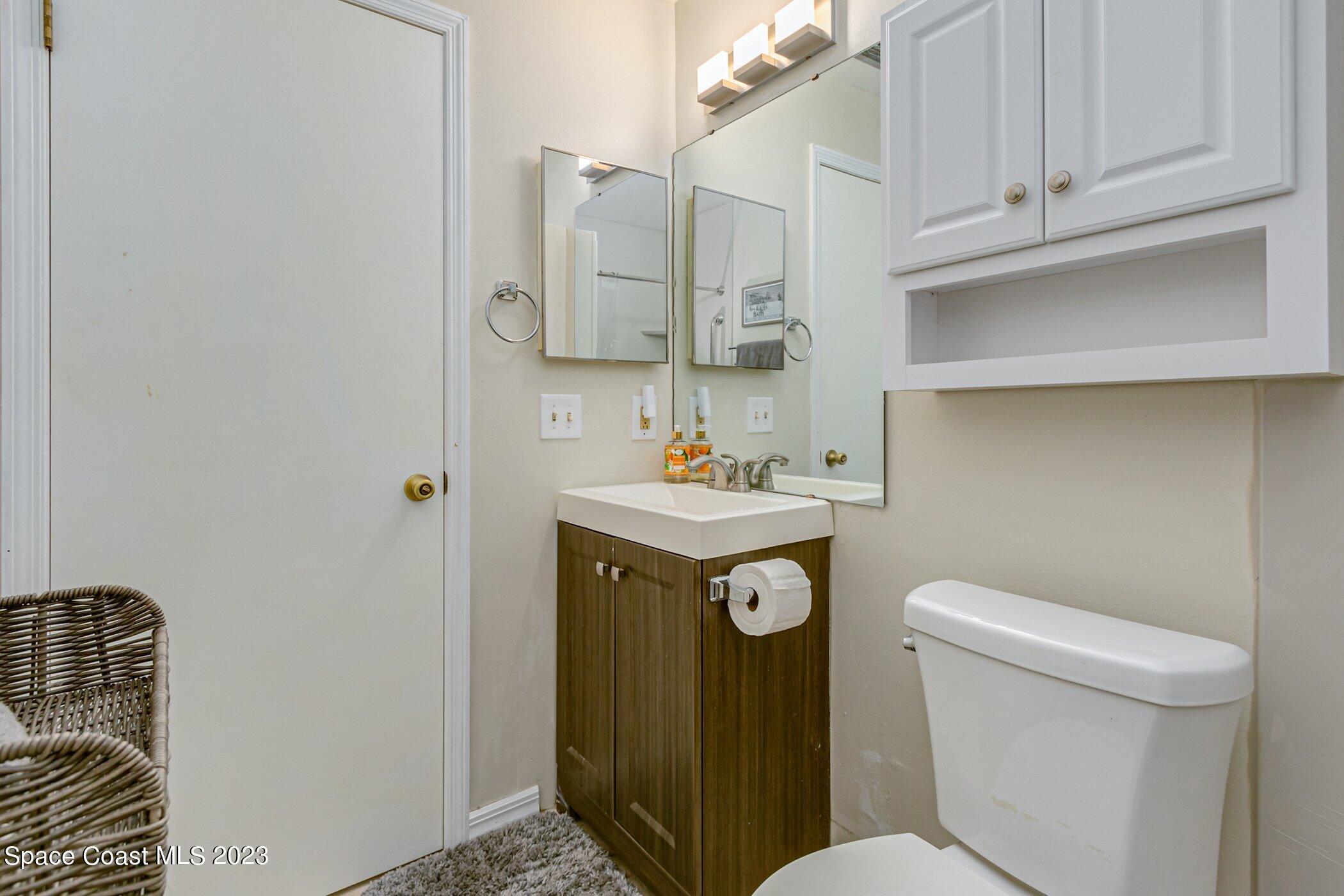 905 Prosperity Place, Unit 1902 Rockledge, FL 32955 - Photo 22 of 35 a bathroom with a sink toilet and shower