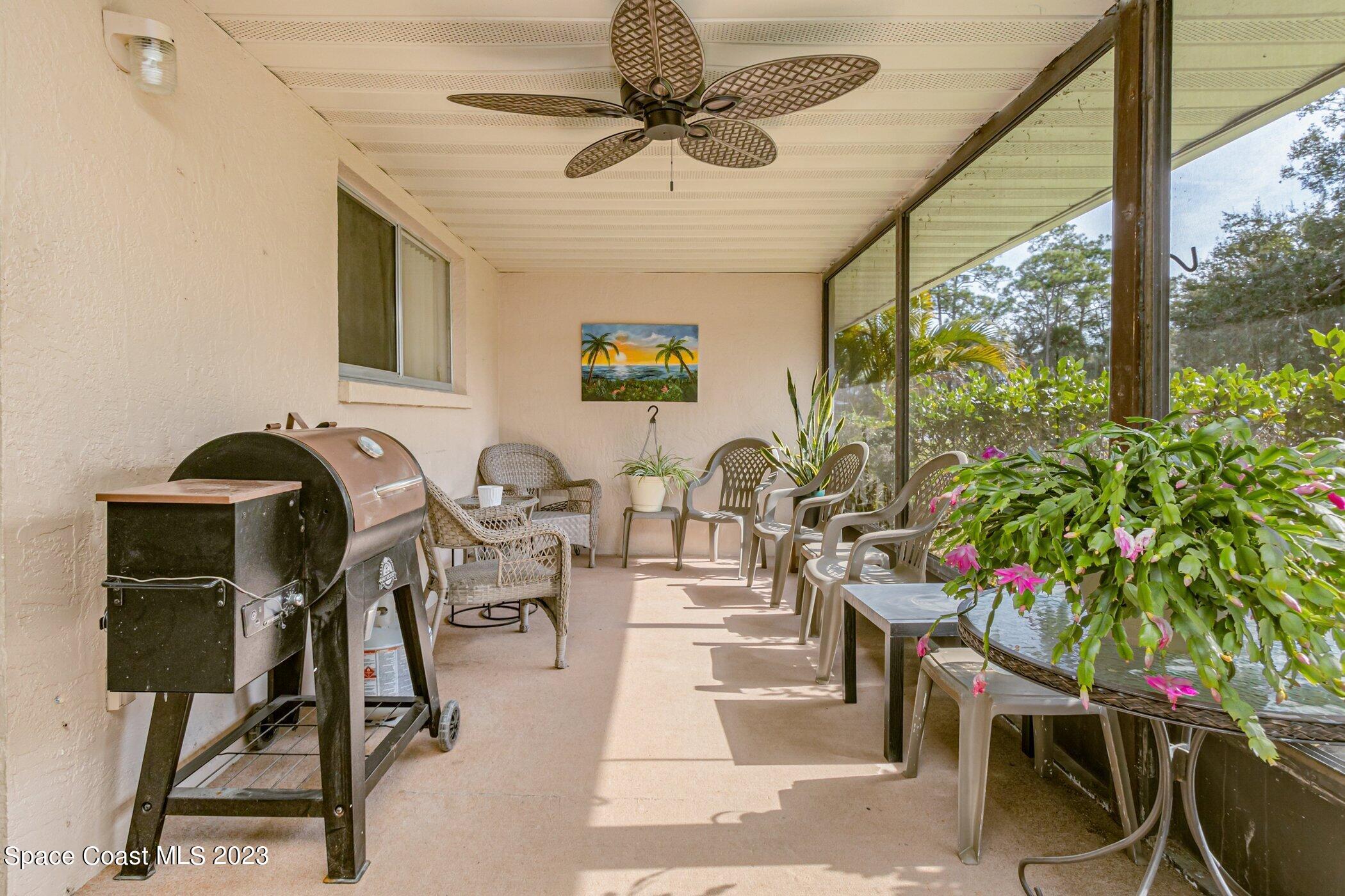 905 Prosperity Place, Unit 1902 Rockledge, FL 32955 - Photo 24 of 35 a view of a livingroom with furniture and a potted plant