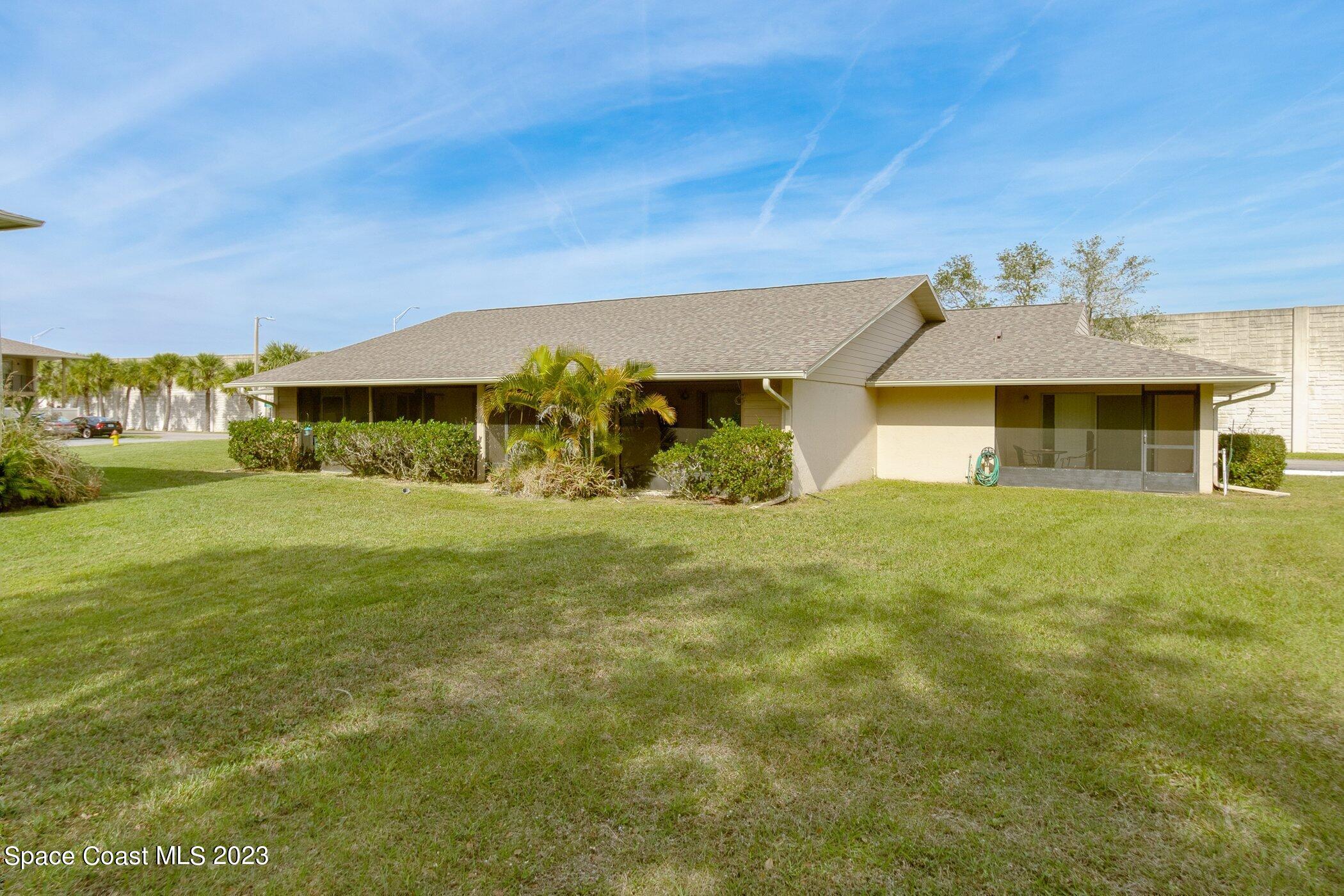 905 Prosperity Place, Unit 1902 Rockledge, FL 32955 - Photo 4 of 35 a front view of a house with a yard