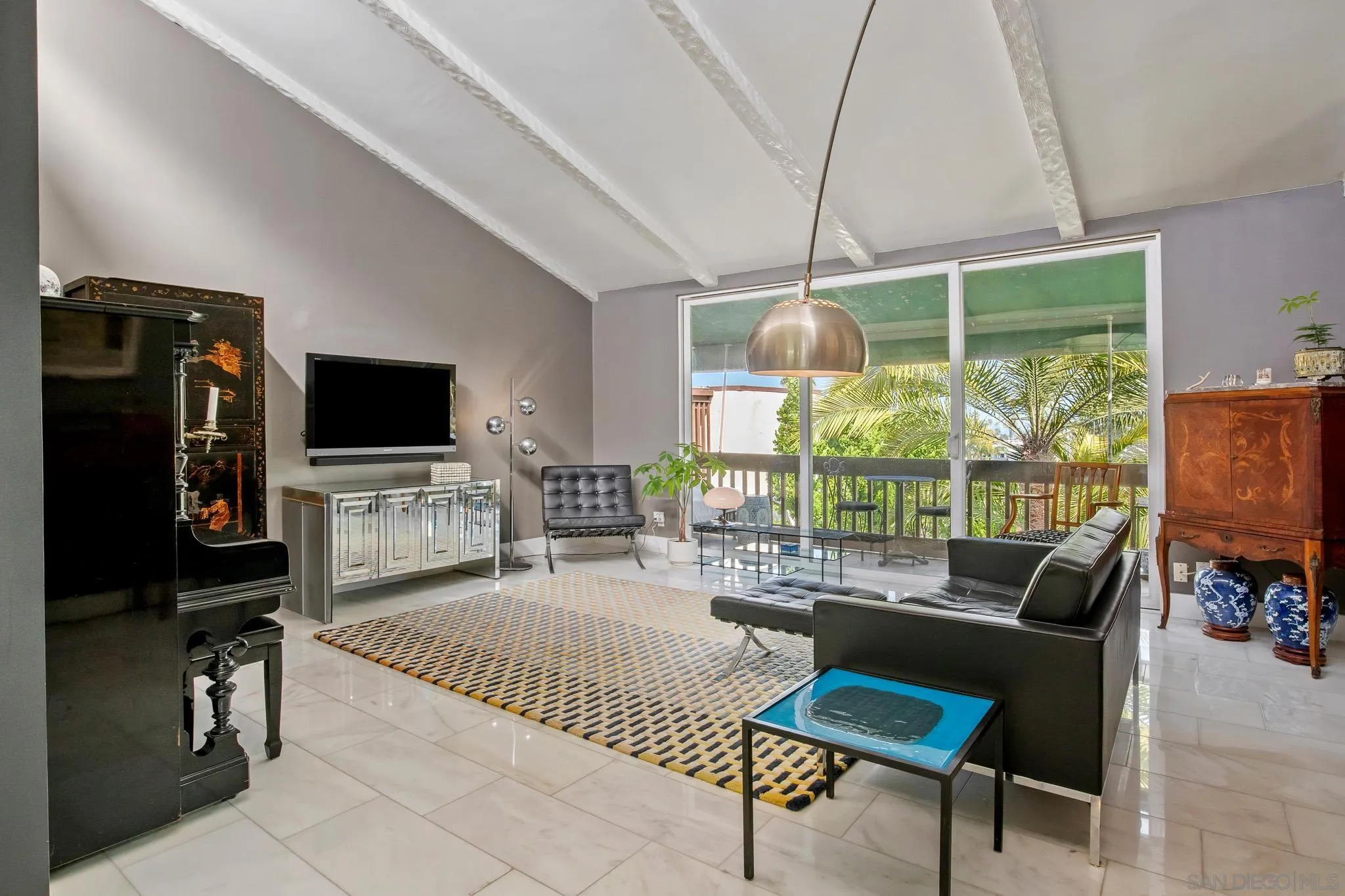 a living room with fireplace furniture and a flat screen tv