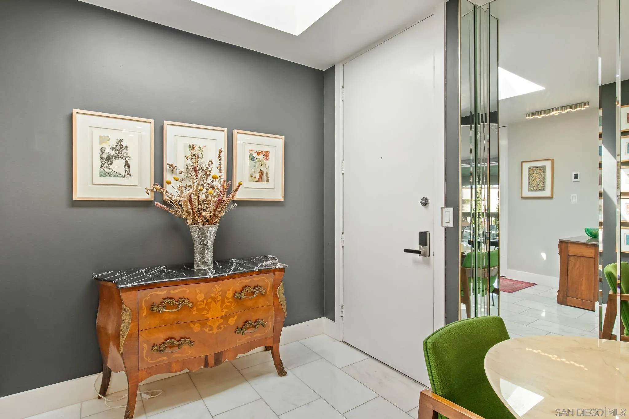 6455 La Jolla Boulevard, Unit 308 La Jolla, CA 92037 - Photo 3 of 18 a living room with furniture and a chandelier