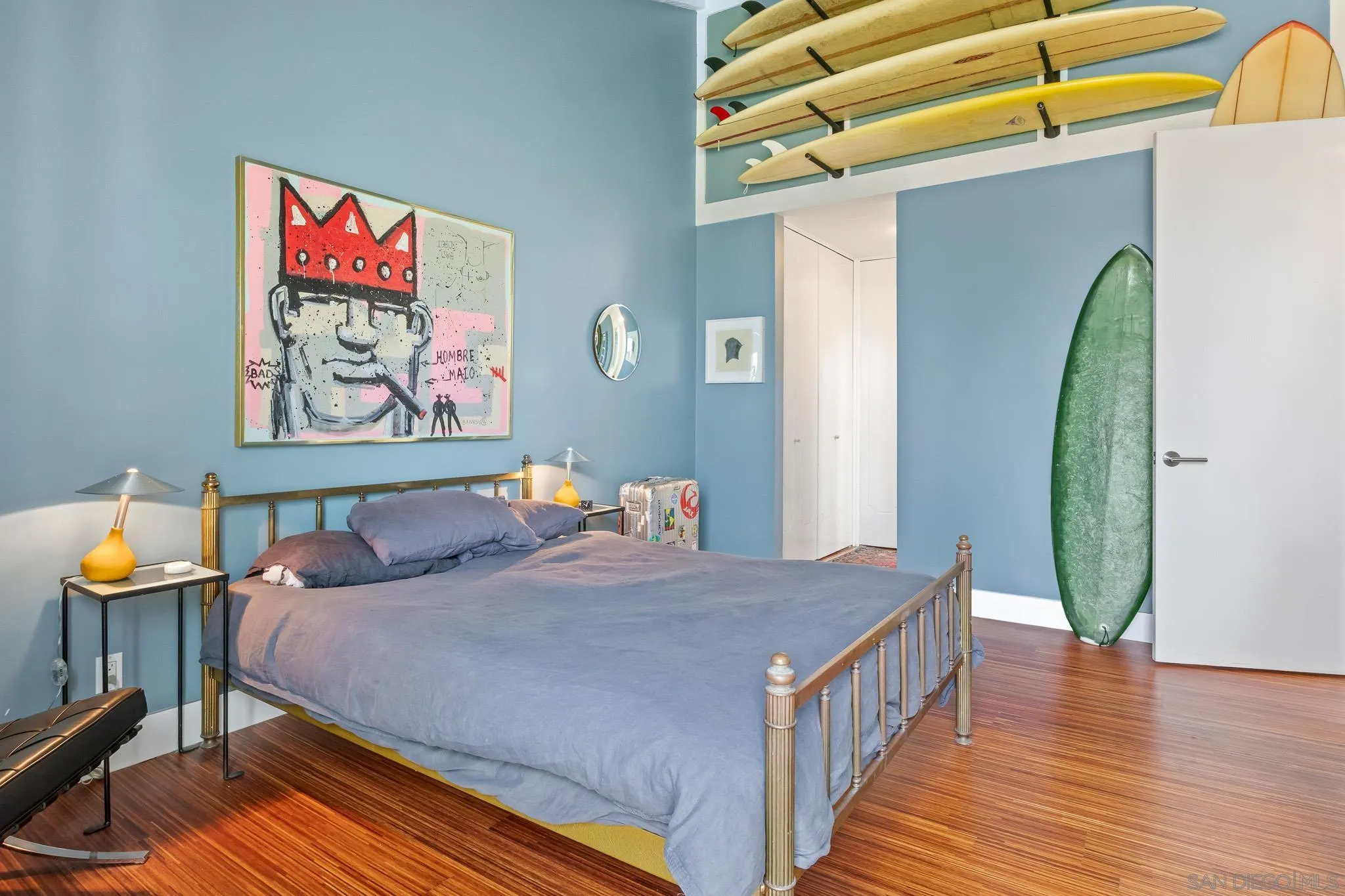 6455 La Jolla Boulevard, Unit 308 La Jolla, CA 92037 - Photo 7 of 18 a bedroom with a bed and a painting on the wall