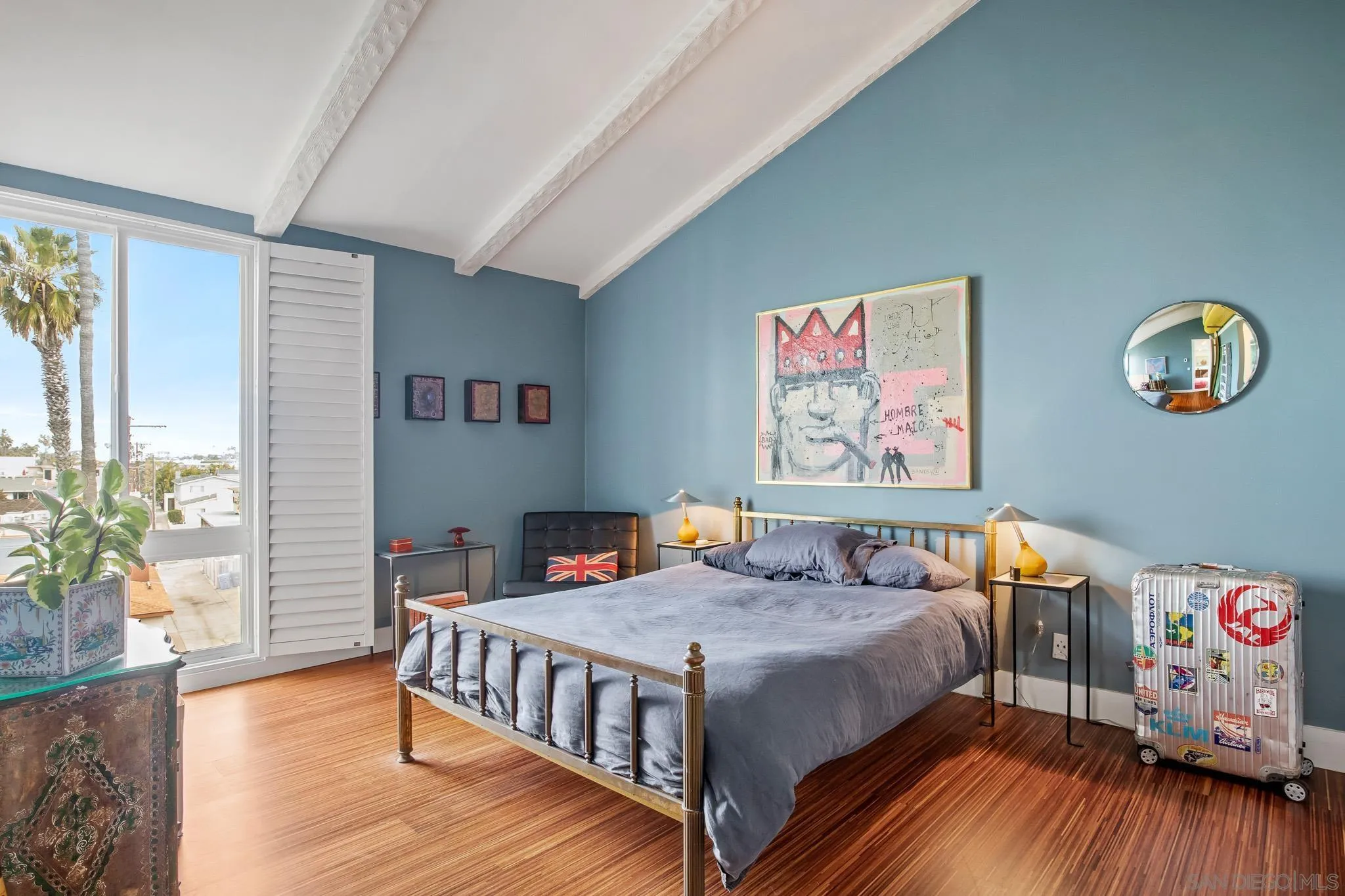 6455 La Jolla Boulevard, Unit 308 La Jolla, CA 92037 - Photo 9 of 18 a bedroom with a bed and a table in it