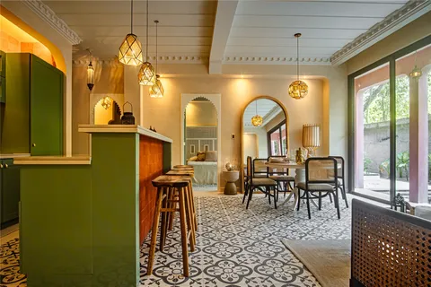 a view of a dining room with furniture window and outside view