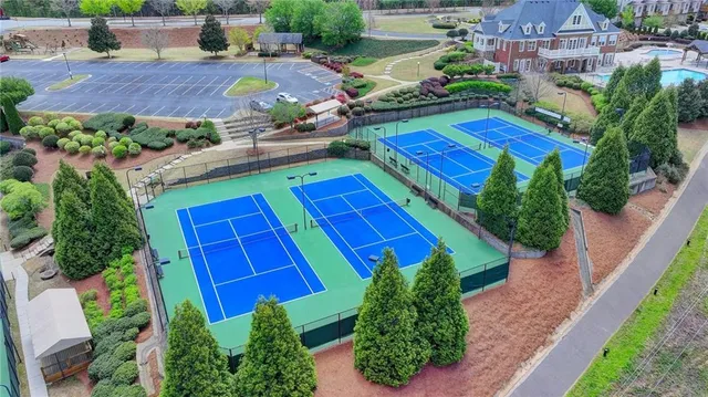 an aerial view of a house with a garden and swimming pool