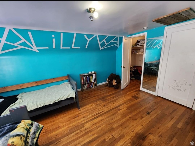 102 South Main Street Paris, ID 83261 - Photo 24 of 33 Bedroom featuring dark wood-style floors and two closets