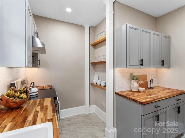 a view of kitchen with cabinets