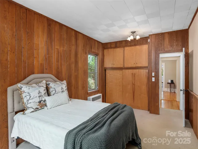 a bedroom with a bed and a table