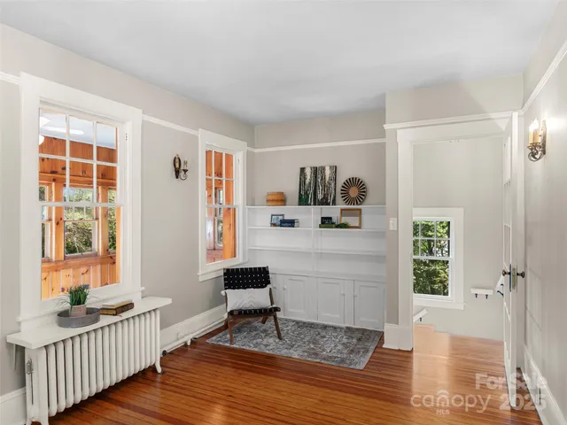 a bedroom with furniture and a window