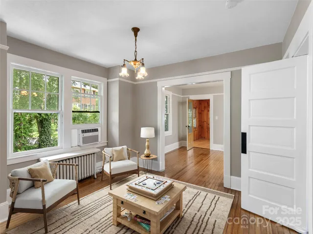 a living room with furniture and a table