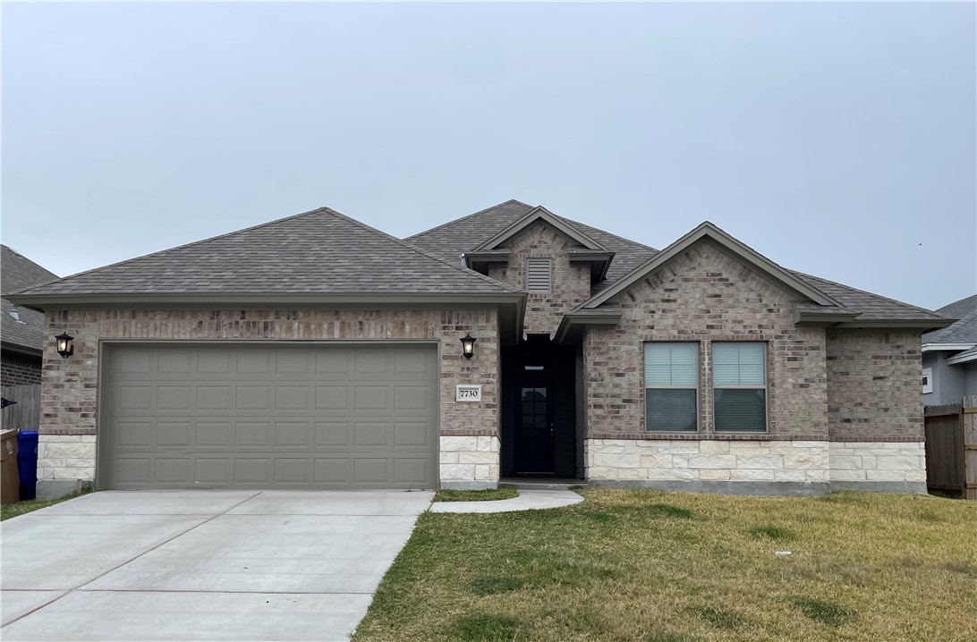 7730 Hulk Drive Corpus Christi, TX 78414 - Photo 1 of 22 a front view of a house with a yard and garage
