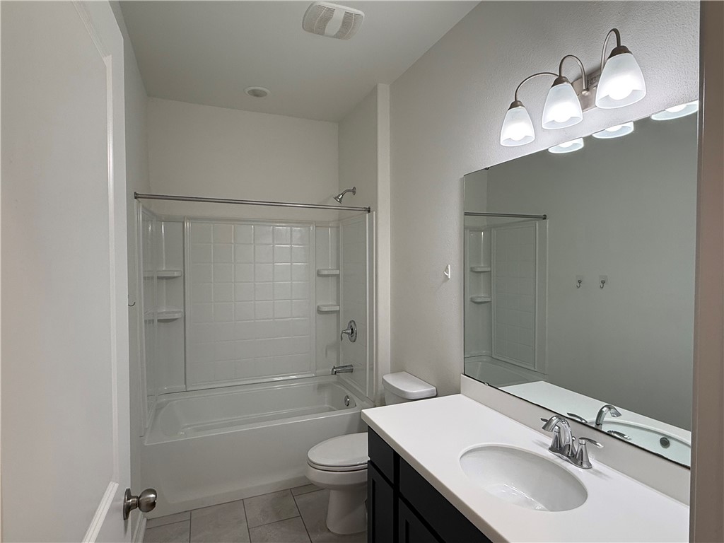 7730 Hulk Drive Corpus Christi, TX 78414 - Photo 15 of 22 a bathroom with a sink a toilet and shower