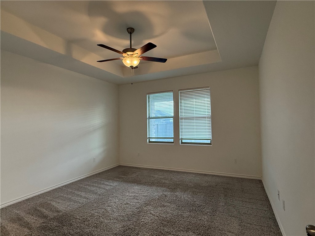 7730 Hulk Drive Corpus Christi, TX 78414 - Photo 16 of 22 an empty room with a window and a fan
