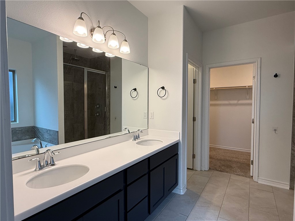 7730 Hulk Drive Corpus Christi, TX 78414 - Photo 18 of 22 a bathroom with a sink double vanity and a mirror