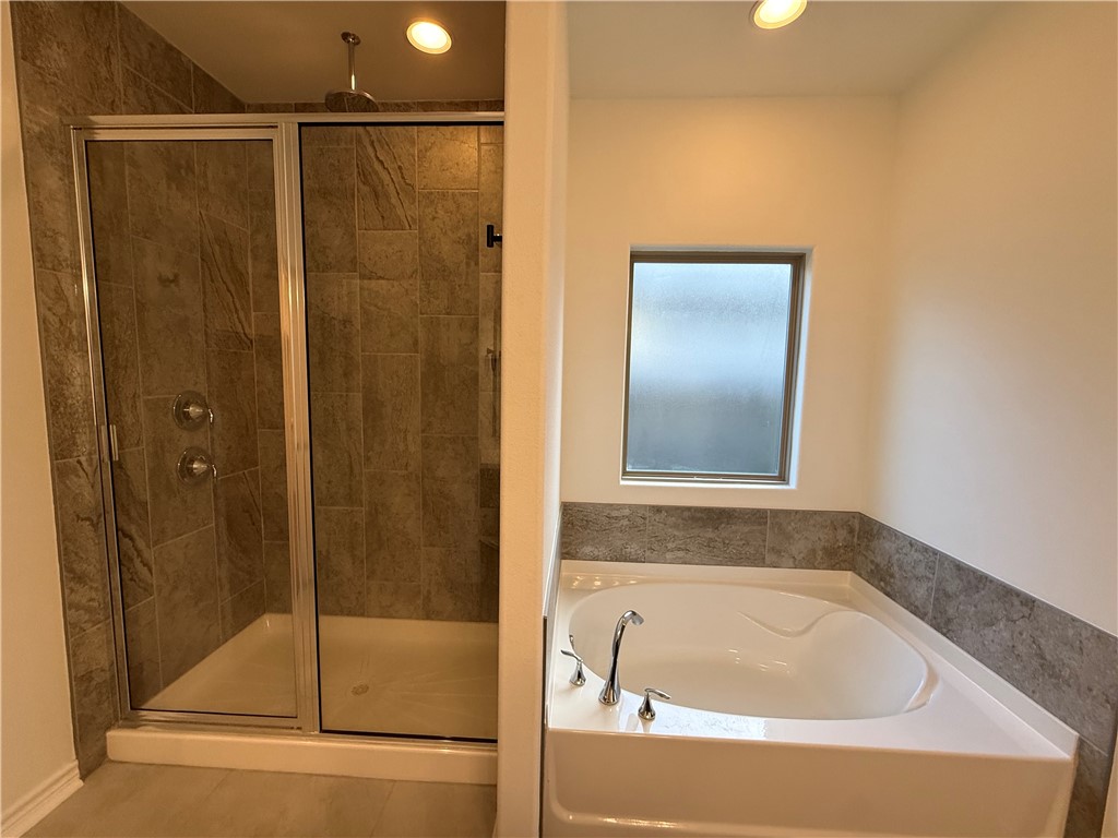 7730 Hulk Drive Corpus Christi, TX 78414 - Photo 19 of 22 a bathroom with a tub and shower