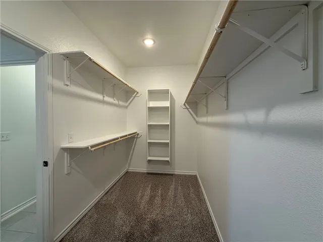 a view of an empty walk in closet