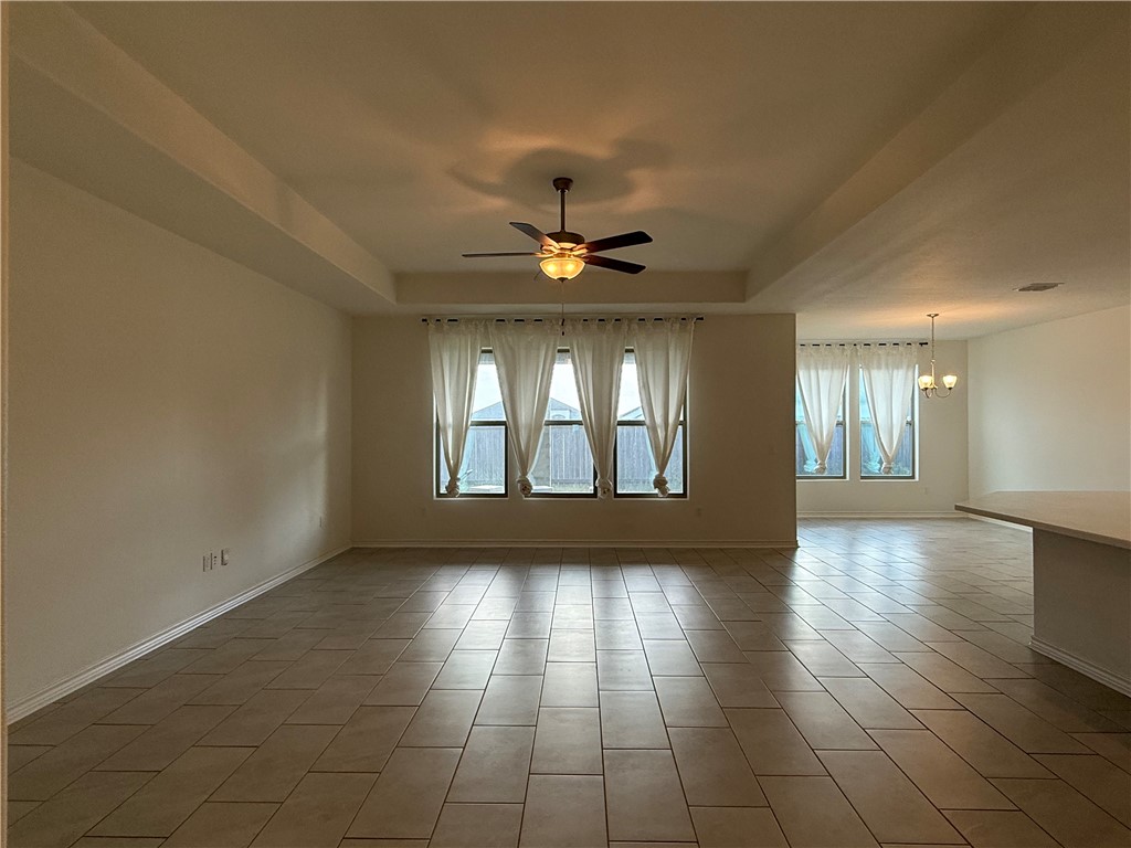7730 Hulk Drive Corpus Christi, TX 78414 - Photo 4 of 22 a view of an empty room with window and wooden floor