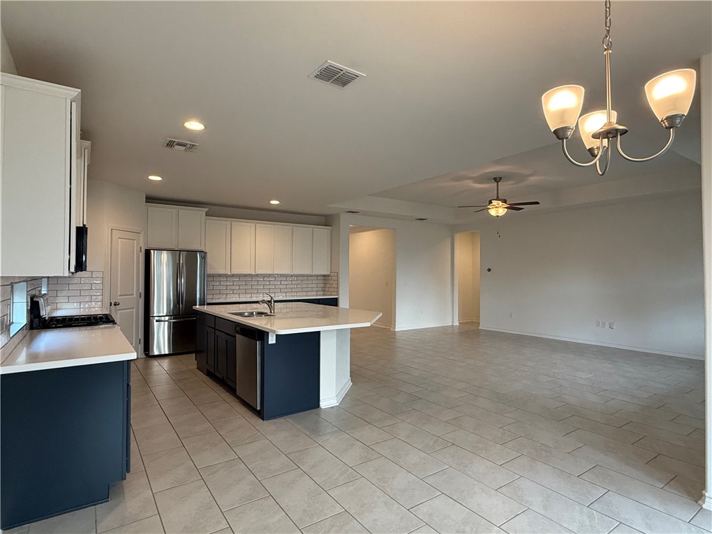 7730 Hulk Drive Corpus Christi, TX 78414 - Photo 6 of 22 a kitchen with granite countertop a sink and a stove