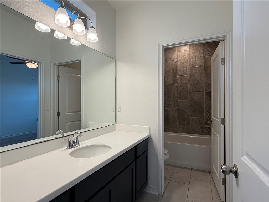 7730 Hulk Drive Corpus Christi, TX 78414 - Photo 9 of 22 a bathroom with a sink a tub and a mirror