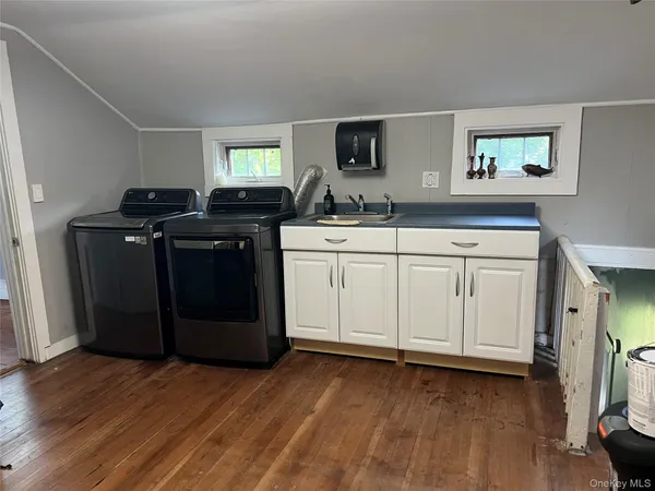 a kitchen with a cabinets and stove top oven
