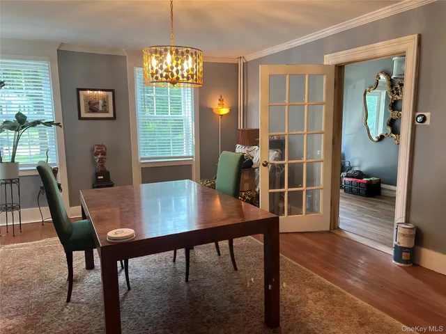 a view of a dining room with furniture and window