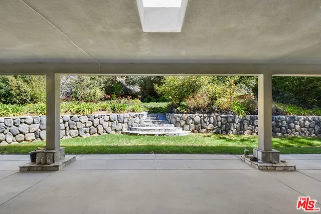 a view of a back yard from a room