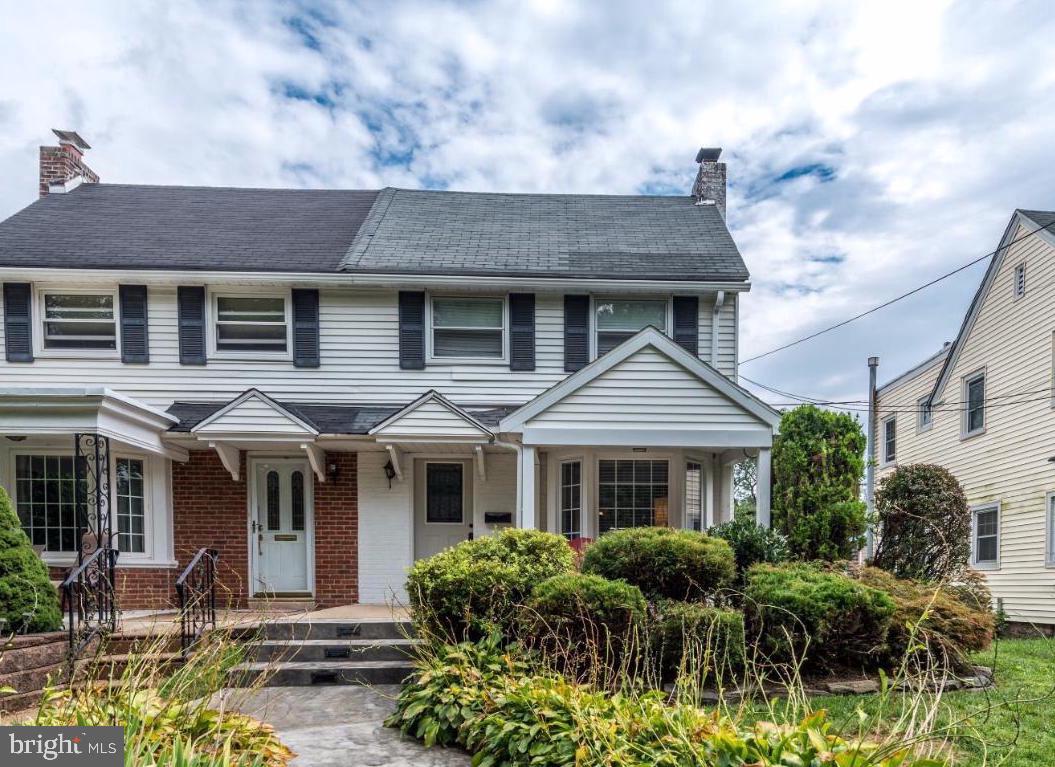 227 Harrogate Road Wynnewood, PA 19096 - Photo 1 of 1 a front view of a house with garden and porch