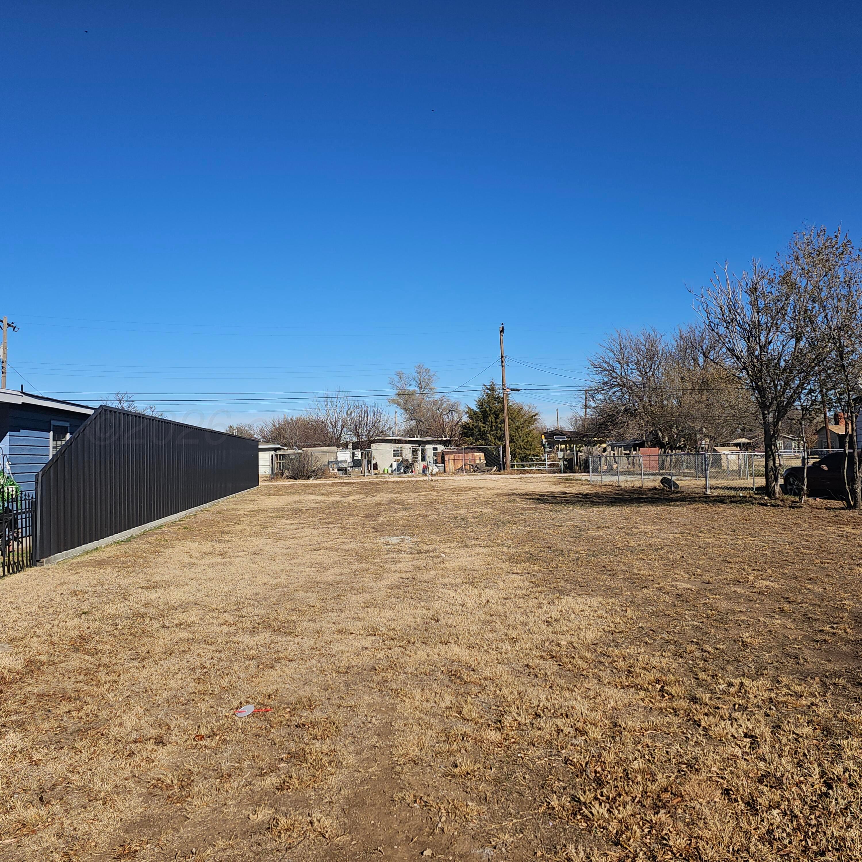 4209 Southeast 15th Avenue Amarillo, TX 79104 - Photo 2 of 3 a view of a field with trees in background