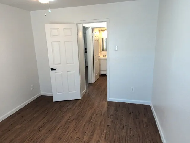 an empty room with wooden floor