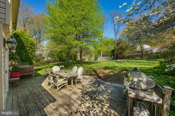a backyard of a house with outdoor seating