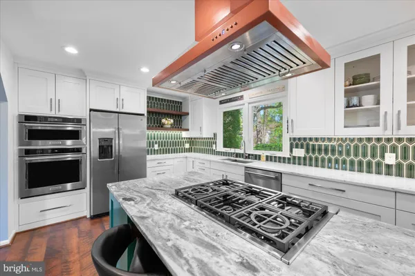 a kitchen with a stove and a microwave