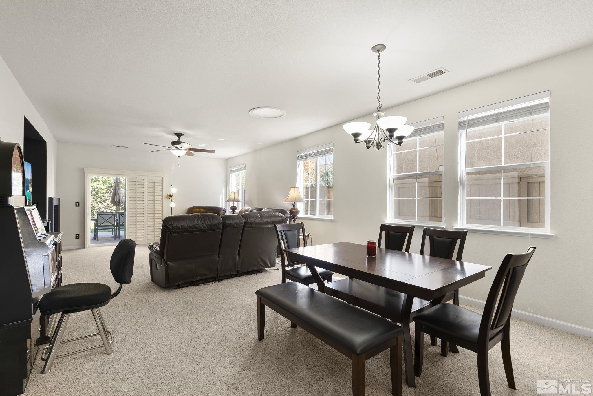 571 Needles Court Reno, NV 89521 - Photo 3 of 22 a view of a dining room with furniture
