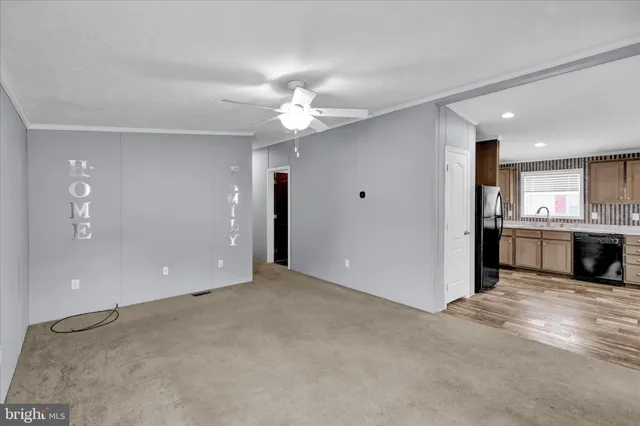 a view of a kitchen with a sink and a window