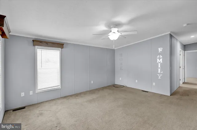 a view of an empty room with a window
